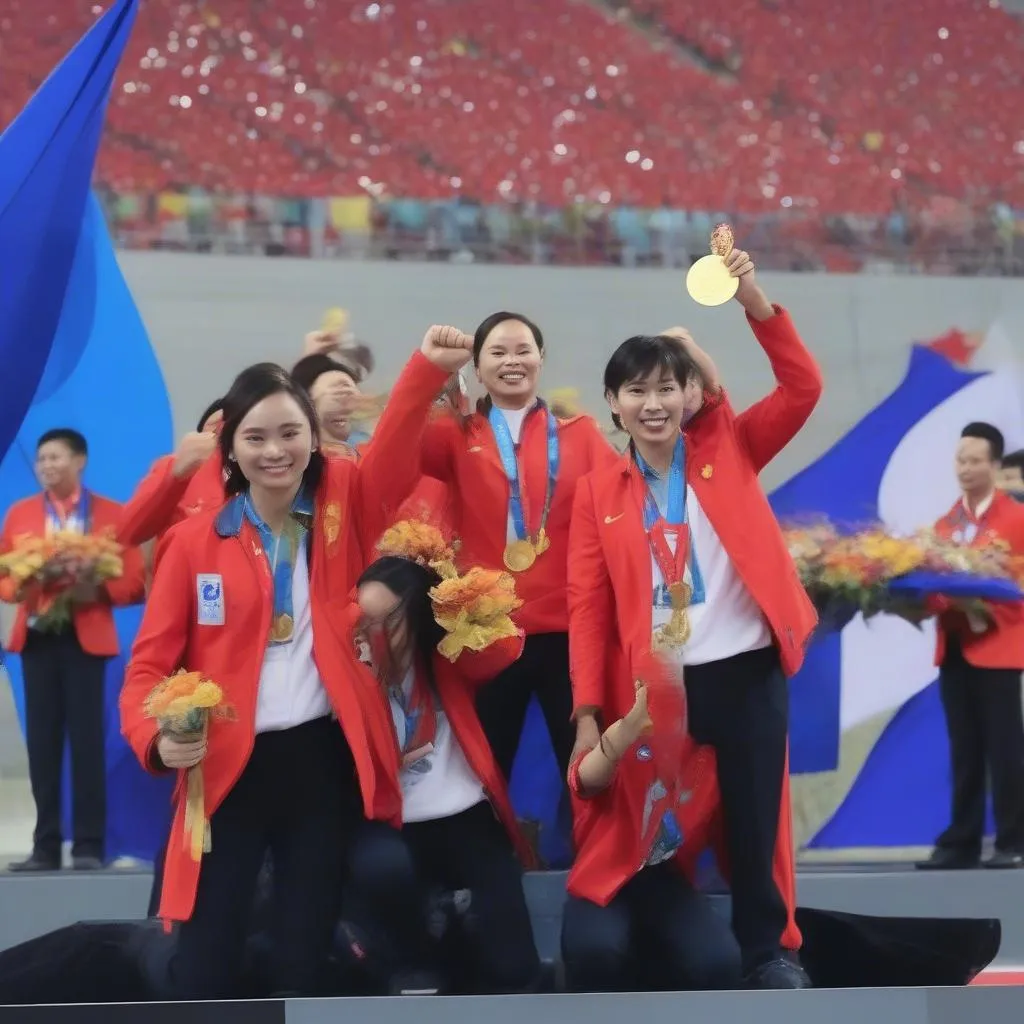 Hình ảnh đoàn thể thao Việt Nam đứng trên bục nhận huy chương vàng SEA Games 31, biểu lộ niềm vui chiến thắng